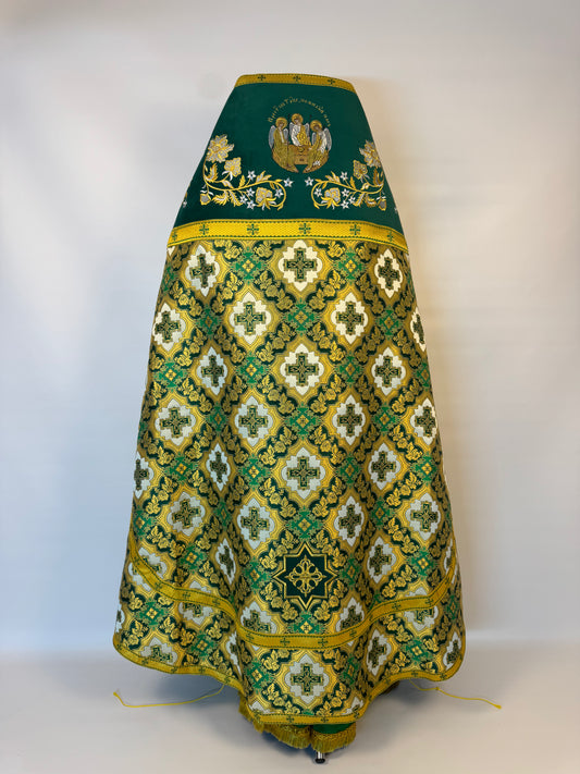 Embroidered green and gold skirt on a white background