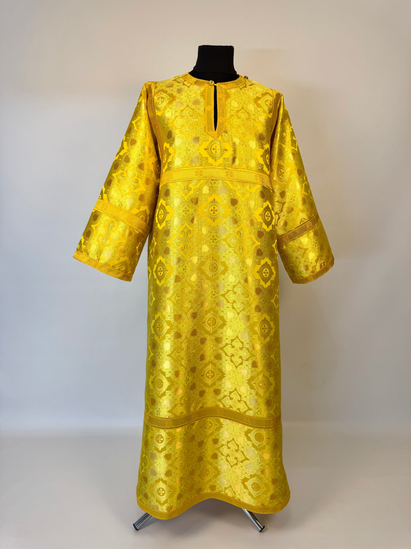 Yellow brocade stychar on a mannequin against