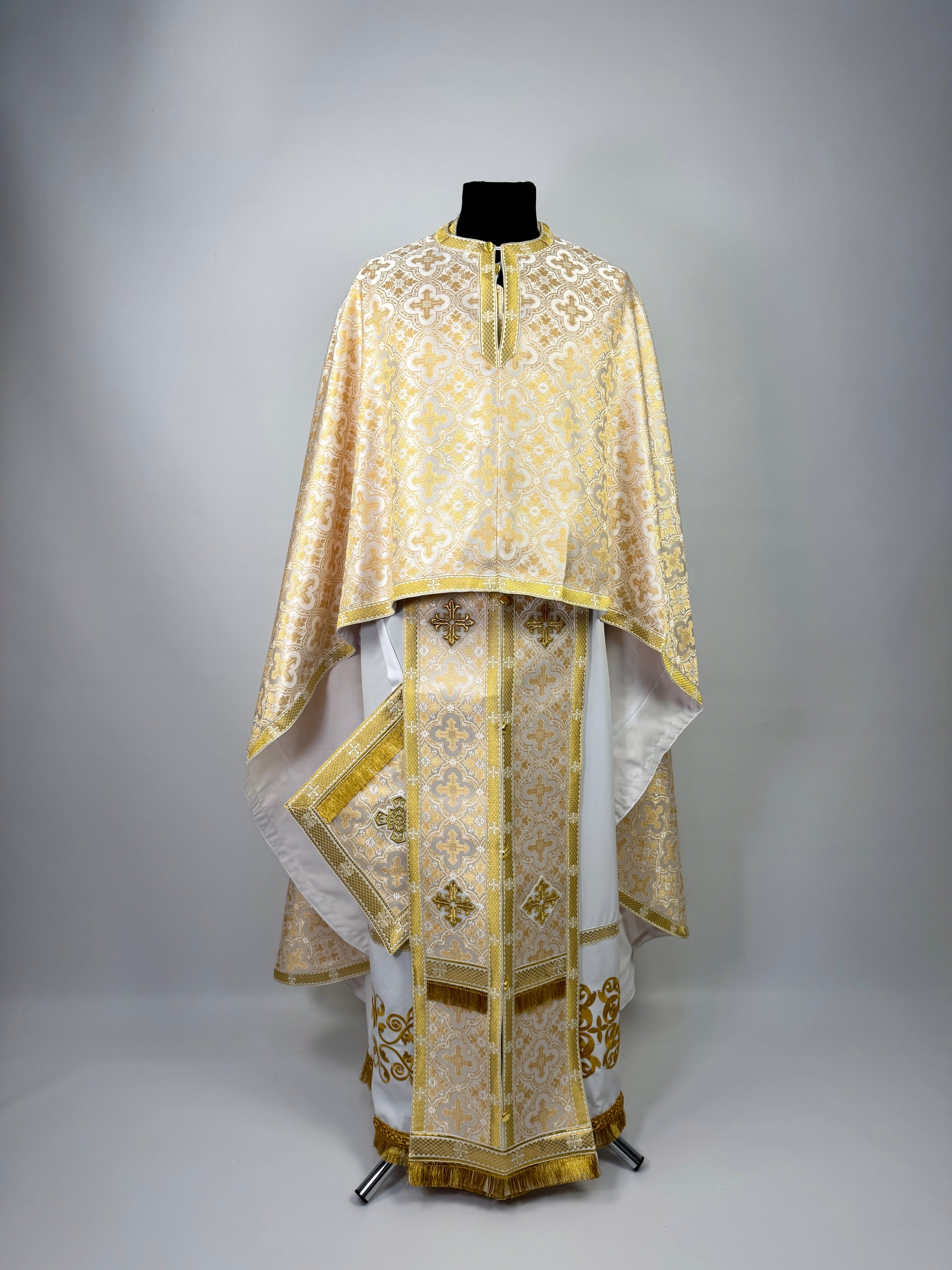 Ecclesiastical vestment with gold embroidery on a gray background